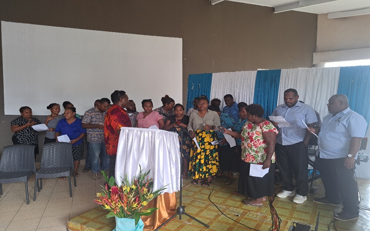 Staff of the Ministry of Communication and Aviation singing a farewell and welcome song.