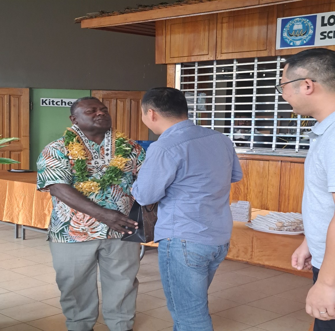 Outgoing Permanent Secretary, Mr Moses Virivolomo was being presented with a gift from Huawei and China Harbour Engineering Companies Representatives